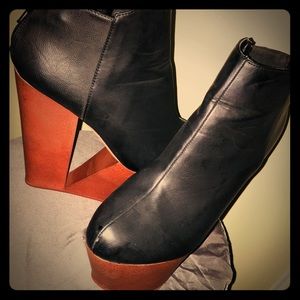 Black platform shoe w/ asymmetrical cutout in heel